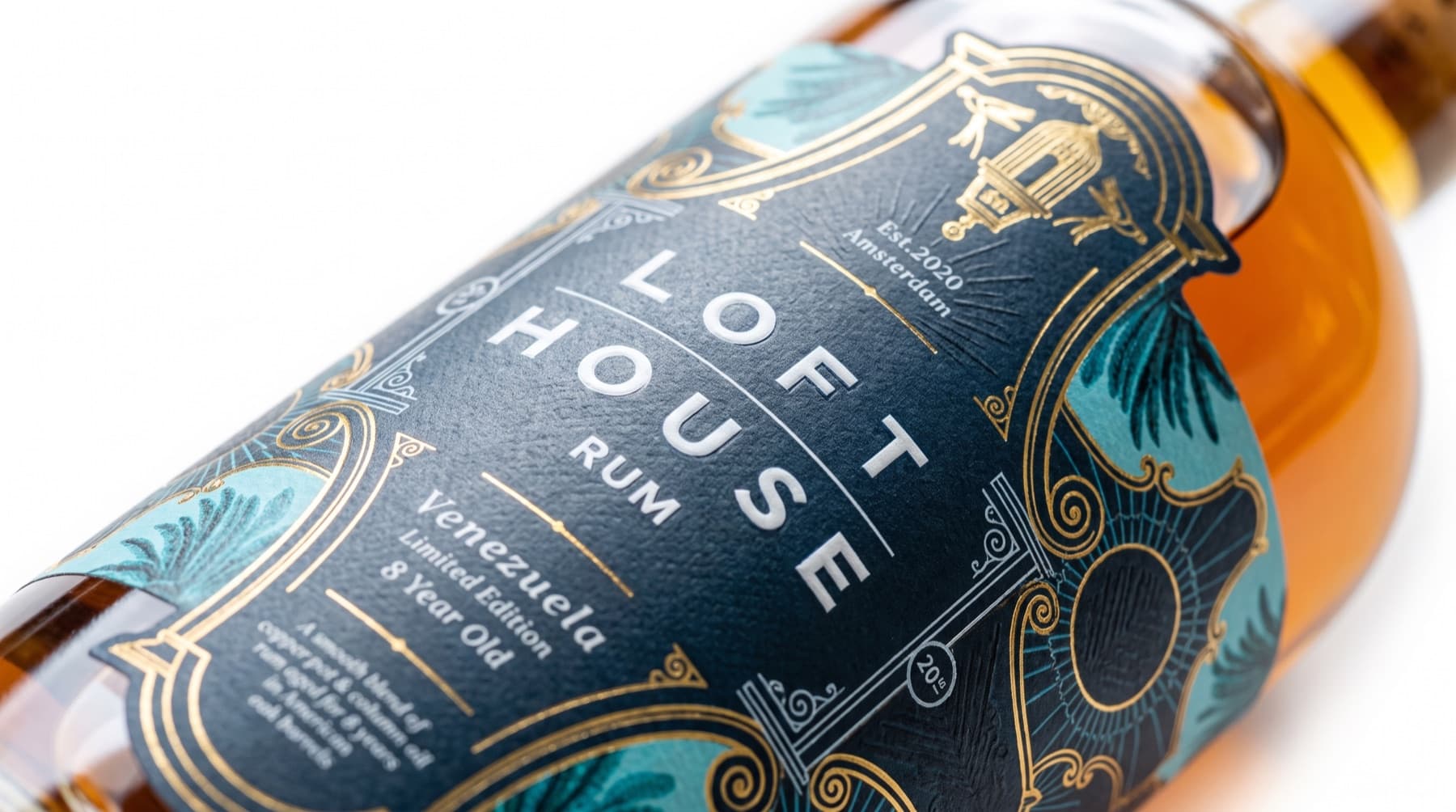 Close-up of the Loft House Venezuela rum navy label with gold foil detailing
