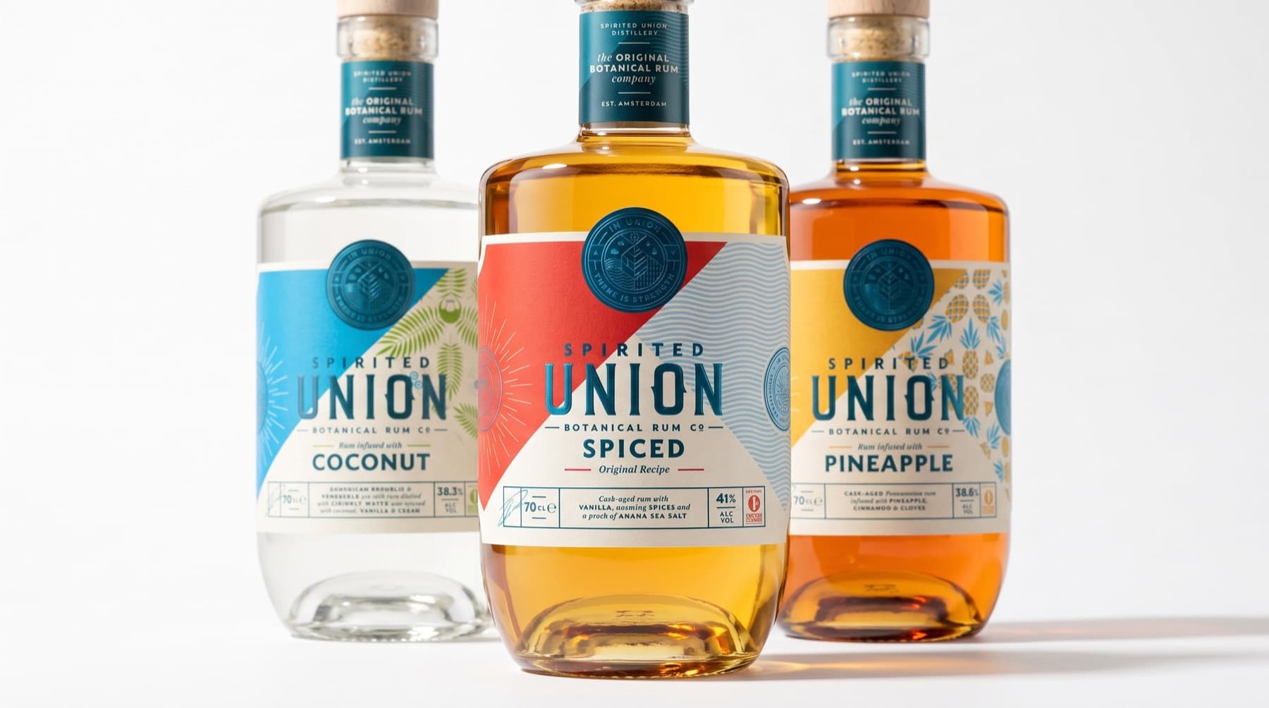 Spirited Union botanical rum range with coconut, spiced and pineapple bottles