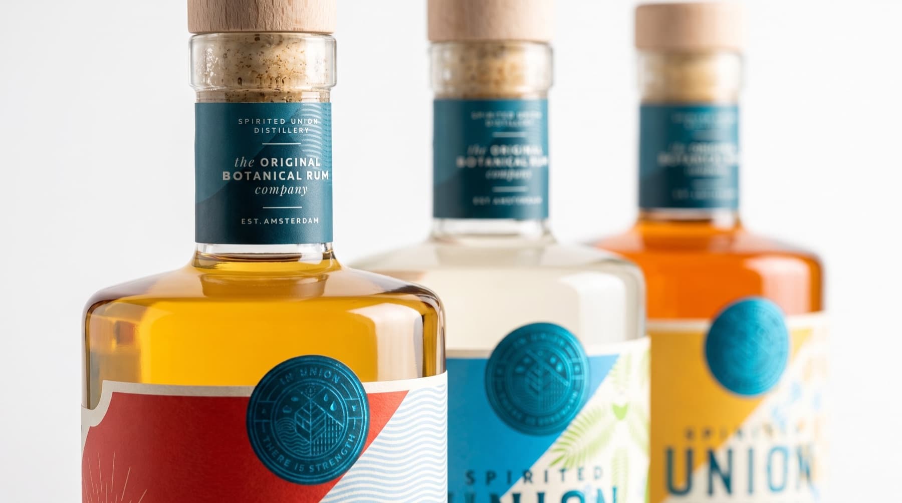 Neck labels and cork closures of Spirited Union botanical rum bottles